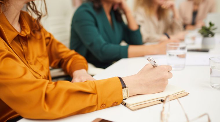 Unrecognizable Businesswomen Coworking Horizontal shot of unrecognizable young women working together in team on new business project during meeting